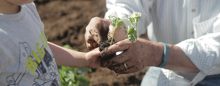 LES children planting vegetables
